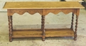 Oak harvest table with hand-carved rope legs.