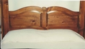 Close-up of pine bed headboard.