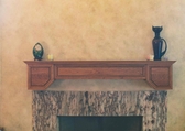 Unique cherry fireplace mantle.